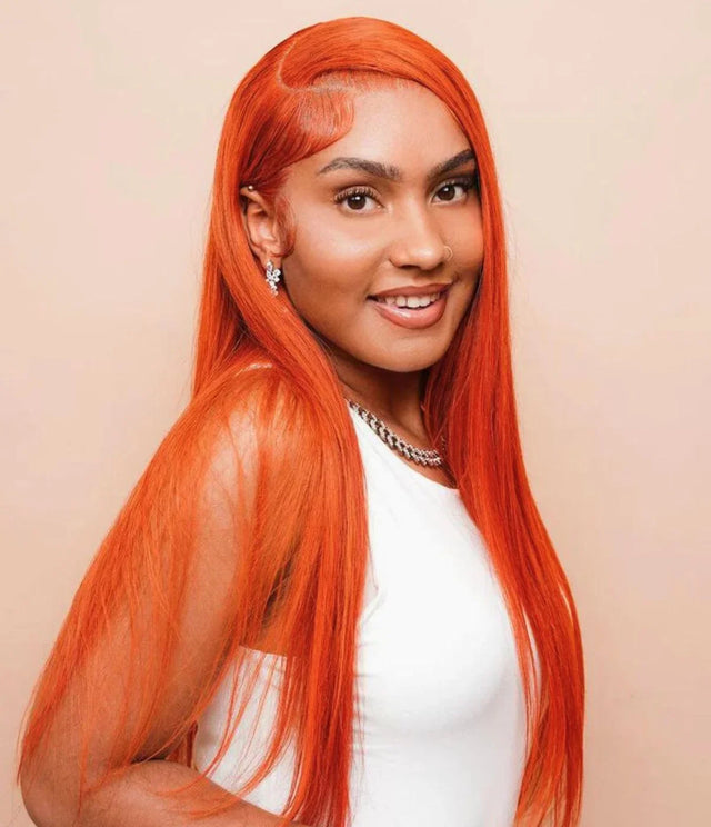 Vibrant orange human hair wig with sleek straight style, perfect for bold natural looks.