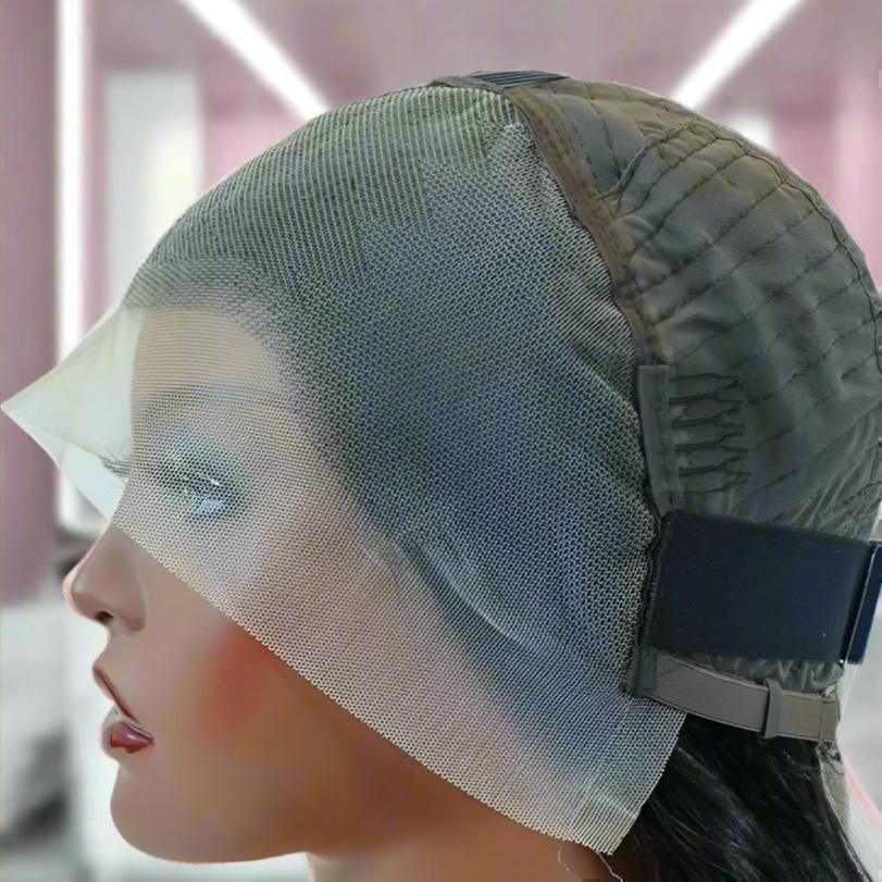 Lace front wig cap on mannequin head, showcasing breathable mesh and adjustable straps for secure fit