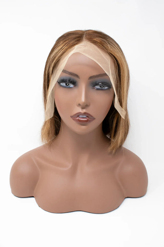 Human hair lace front wig with natural bob style on mannequin, showcasing seamless hairline and soft texture