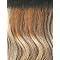 Ombre human hair wig with wavy texture, dark roots fading to golden brown tips