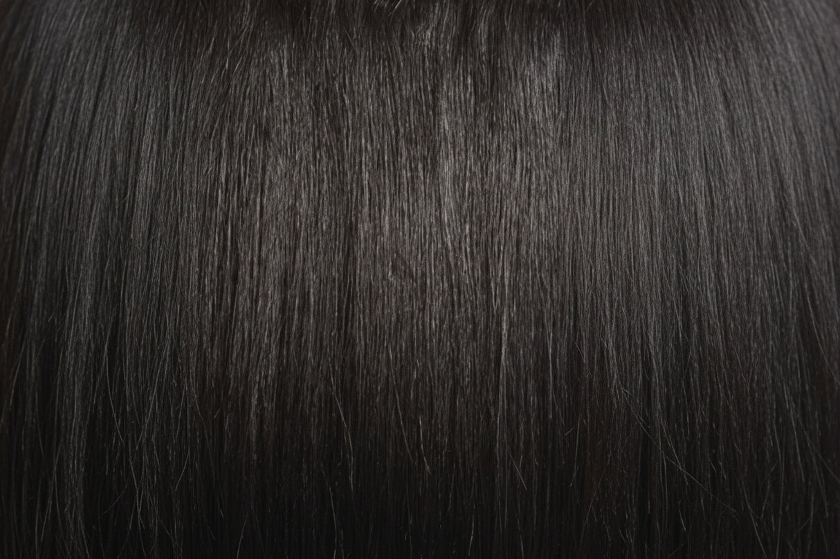 Two packages of Outre Premium Purple Pack Yaki hair extensions, showcasing the product as 100% human hair with a straight texture.