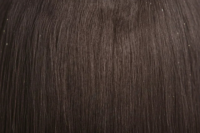 Two packages of Outre Premium Purple Pack Yaki hair extensions, showcasing the product as 100% human hair with a straight texture.