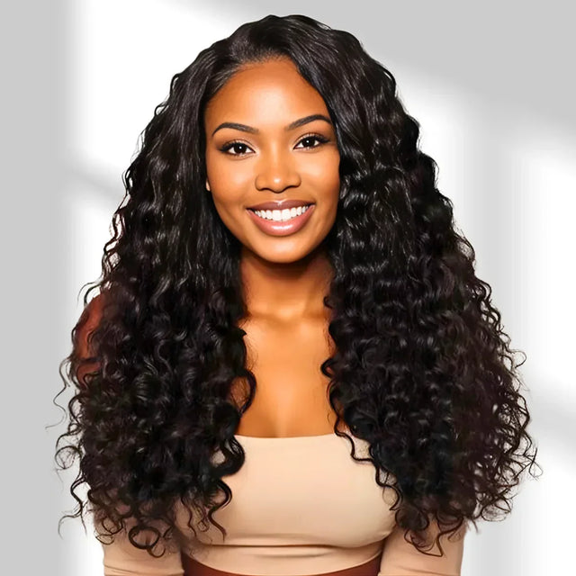 Woman with long, curly black hair against a light gray background