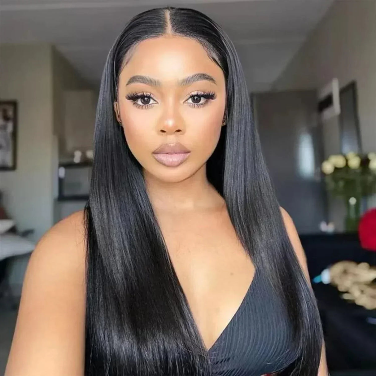 Long straight human hair wig with natural part, sleek black style for everyday wear