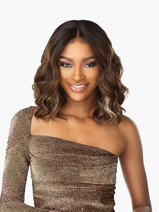 Woman wearing a natural wavy human hair wig with highlights, styled for everyday elegance.