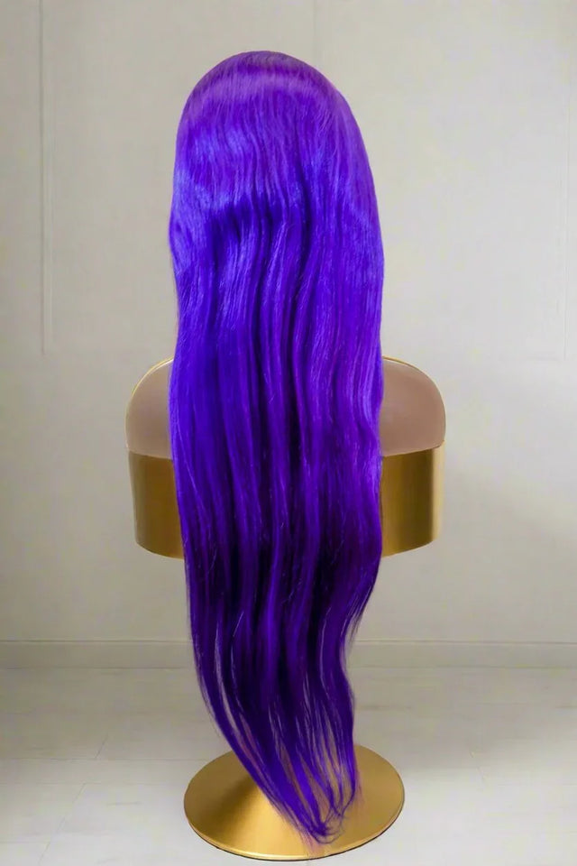 Vibrant purple long wavy human hair wig on mannequin, premium quality for natural styling