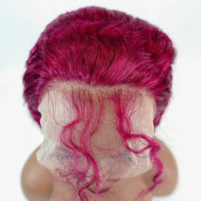 Vibrant pink human hair lace front wig with curly texture and natural-looking hairline
