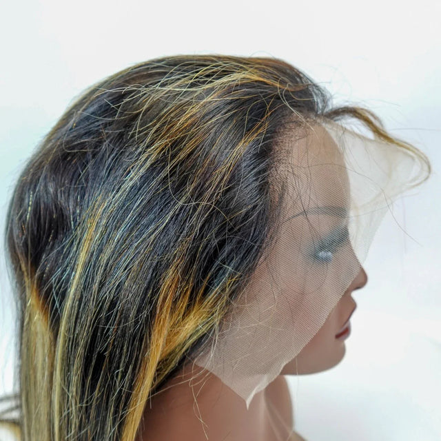 Human hair lace front wig with dark roots and blonde highlights, natural-looking hairline on mannequin