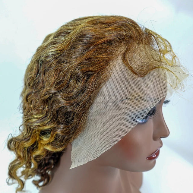 Curly human hair wig with lace front on mannequin, natural-looking waves and blendable hairline