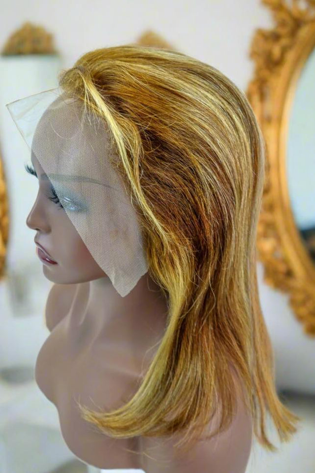 Blonde human hair lace front wig with natural waves on mannequin, styled for everyday wear