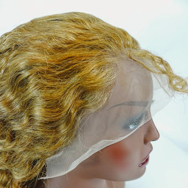 Blonde human hair lace front wig with natural curls on mannequin head