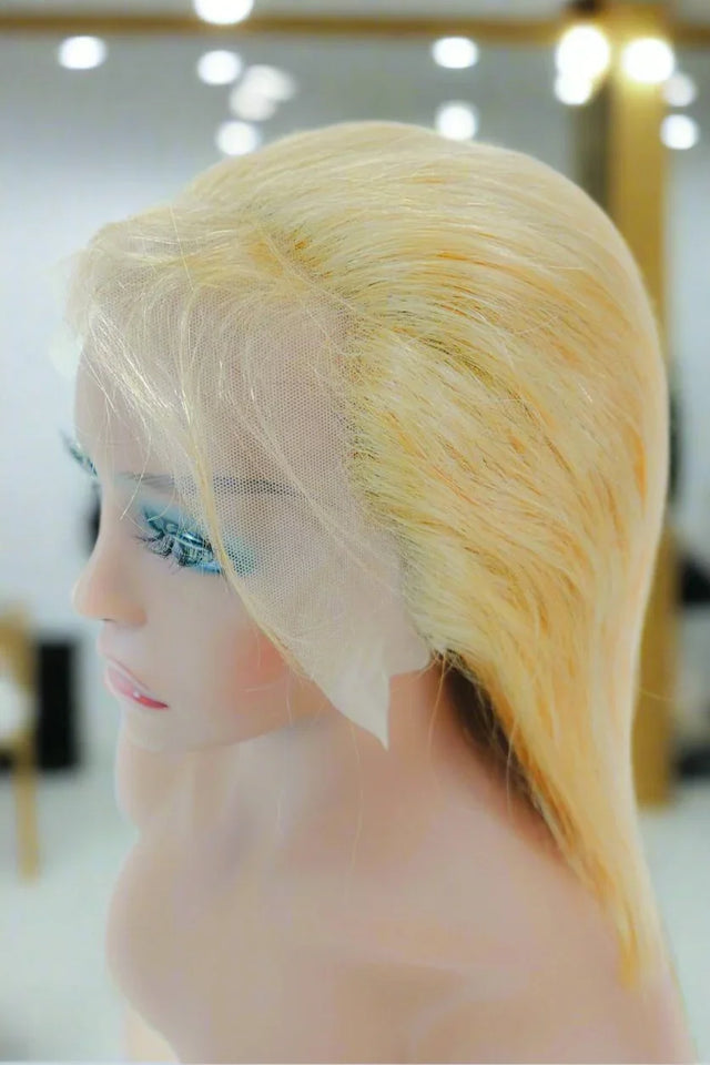 Blonde human hair lace front wig on mannequin, natural styling with transparent lace part
