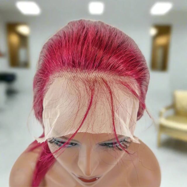 Vibrant pink human hair lace front wig on mannequin, showcasing natural-looking hairline and premium texture