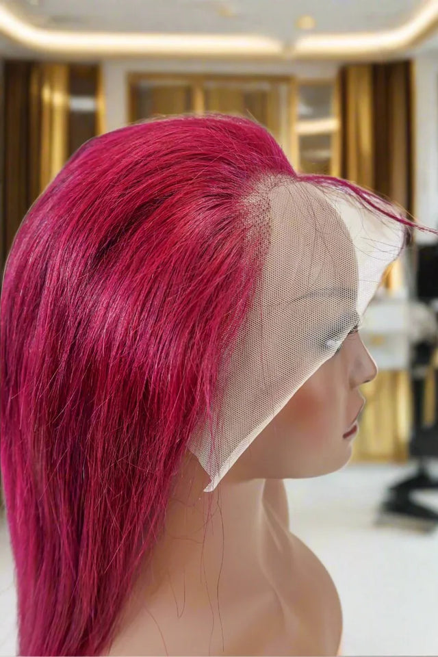 Vibrant pink human hair lace front wig on mannequin, showcasing natural styling and seamless blend