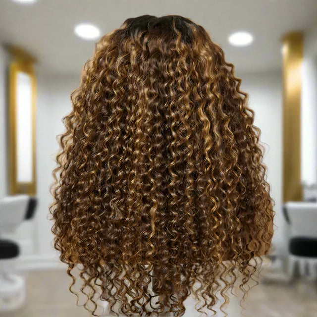 Luxury human hair wig with voluminous caramel curls, salon-styled for natural, bouncy texture