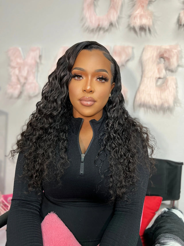Woman with long curly human hair wig, styled naturally for beauty essentials