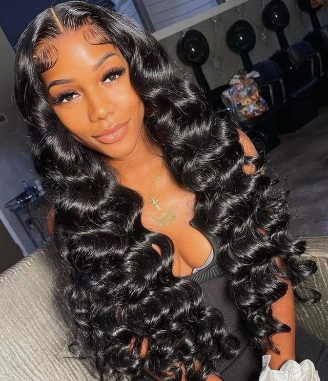 Woman wearing voluminous deep wave human hair wig with natural-looking lace front