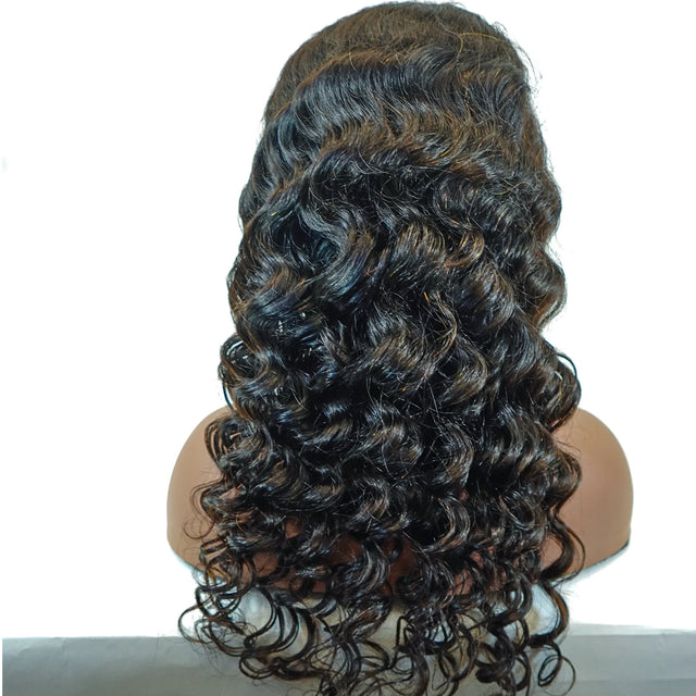 Deep wave human hair wig with natural-looking curls and highlights on mannequin head