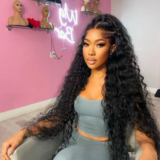 Woman wearing long curly human hair wig with lace front, styled in loose waves, perfect for natural looks