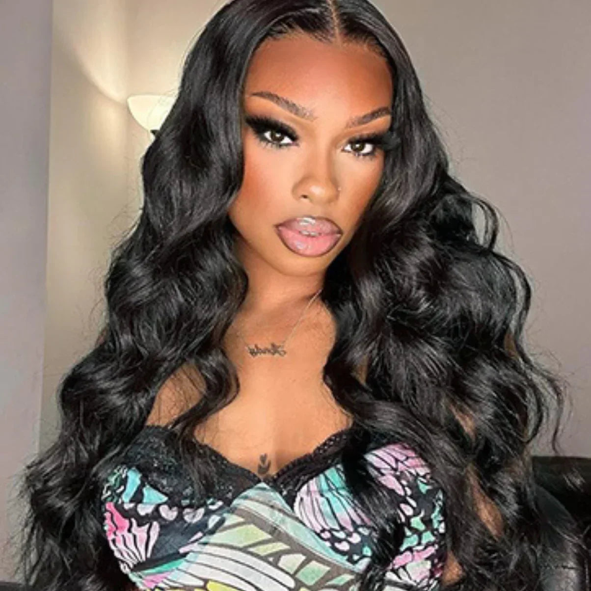 Woman wearing long, wavy black human hair wig with natural-looking lace front