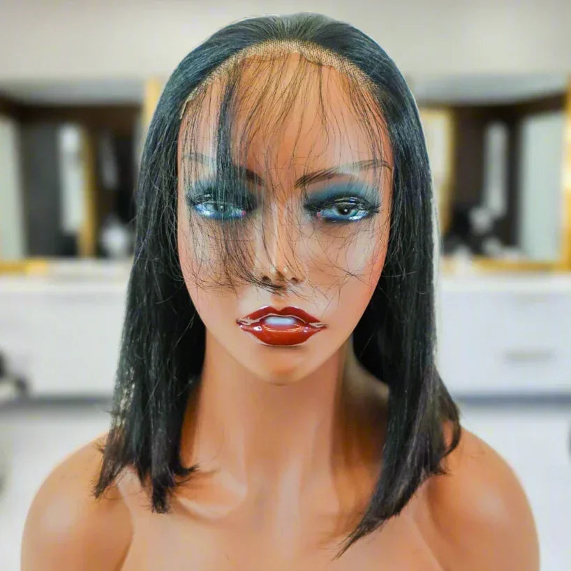 Natural straight human hair wig with lace front on mannequin, sleek bob style for everyday wear