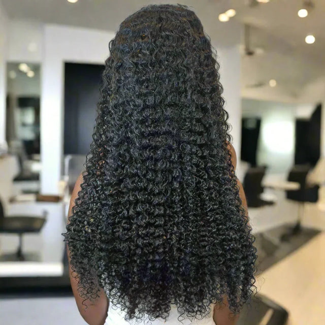 Long curly human hair wig with natural volume, perfect for styling in salon setting