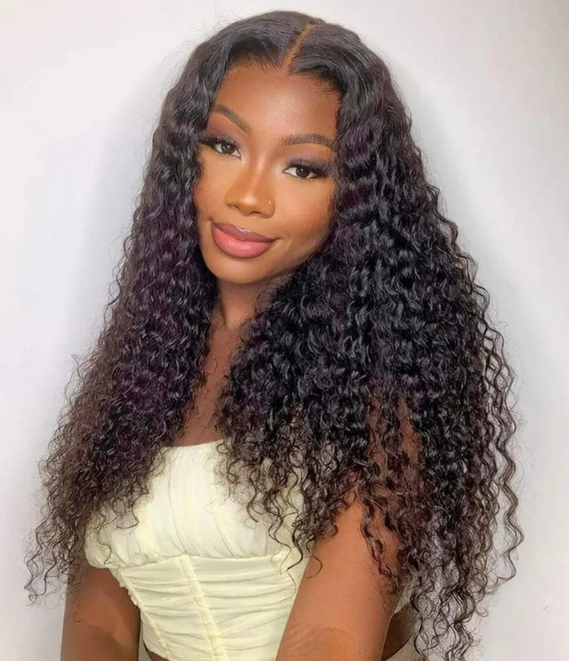 Woman wearing long, curly human hair wig with natural-looking lace front and deep waves