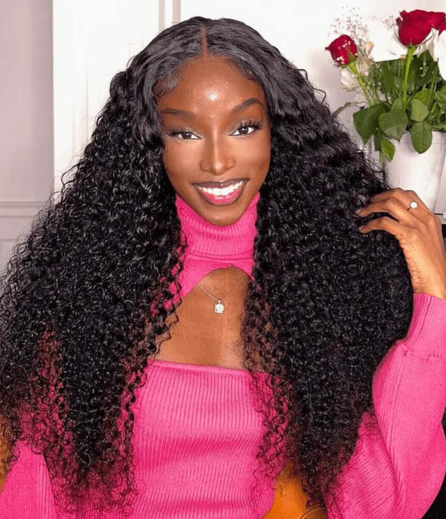 Woman wearing long, curly human hair wig with natural waves, styled for volume and shine.