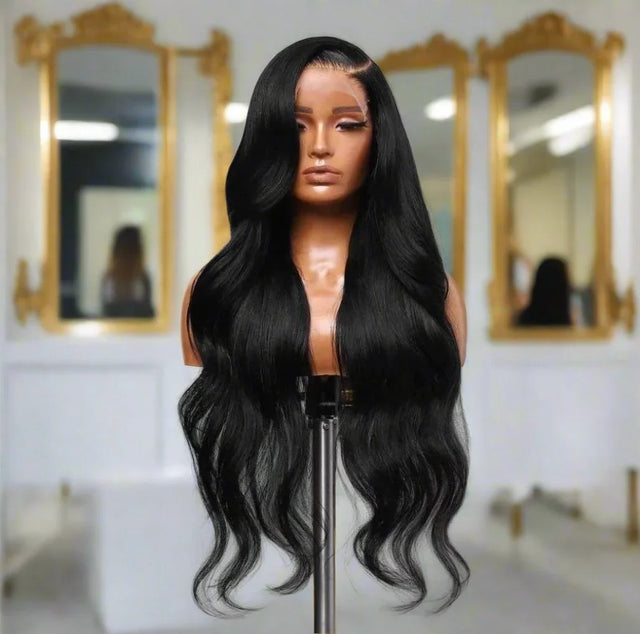 Long black body wave human hair wig on mannequin, luxury salon mirror background