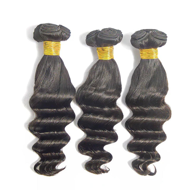 Three bundles of natural body wave human hair with gold bands, ideal for styling and extensions.