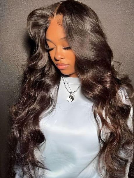 Luxury human hair wig with deep waves, natural part, and soft gray-brown ombre for effortless styling