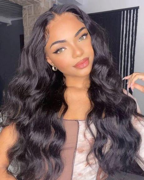 Woman wearing long, wavy human hair wig with natural-looking lace front and voluminous curls