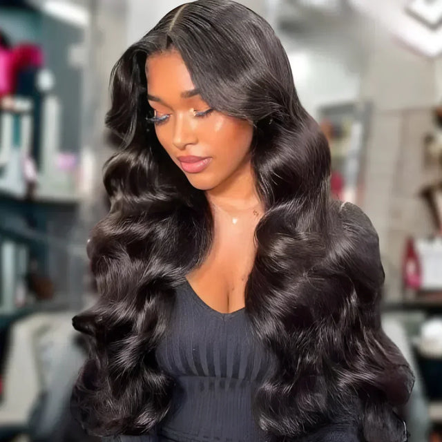 Luxury human hair wig with deep body waves, natural part, and glossy finish for elegant styling.