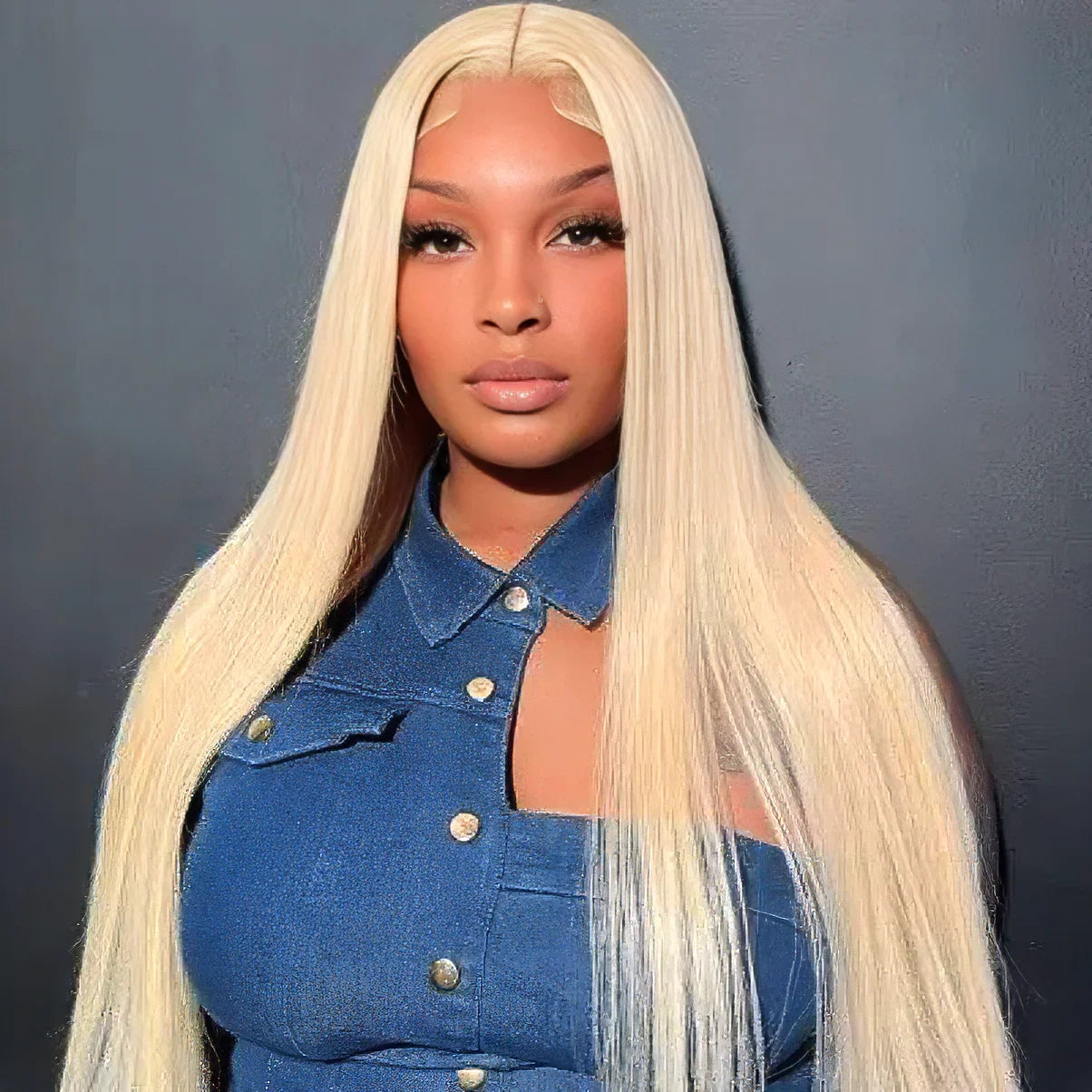 Blonde human hair lace front wig with straight long hair, styled on model in denim top