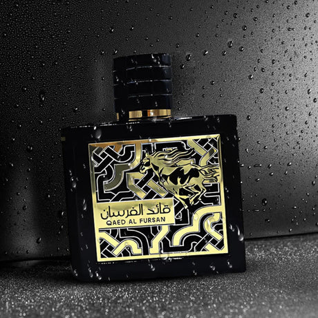 Luxury black perfume bottle with gold horse design, Qaed Al Fursan, on wet dark surface