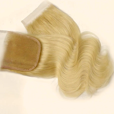 Blonde human hair lace closure with body wave texture and transparent base for natural styling