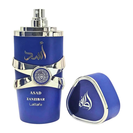 Luxury blue Asad Zanzibar perfume bottle with silver accents and matching cap, Lattafa brand