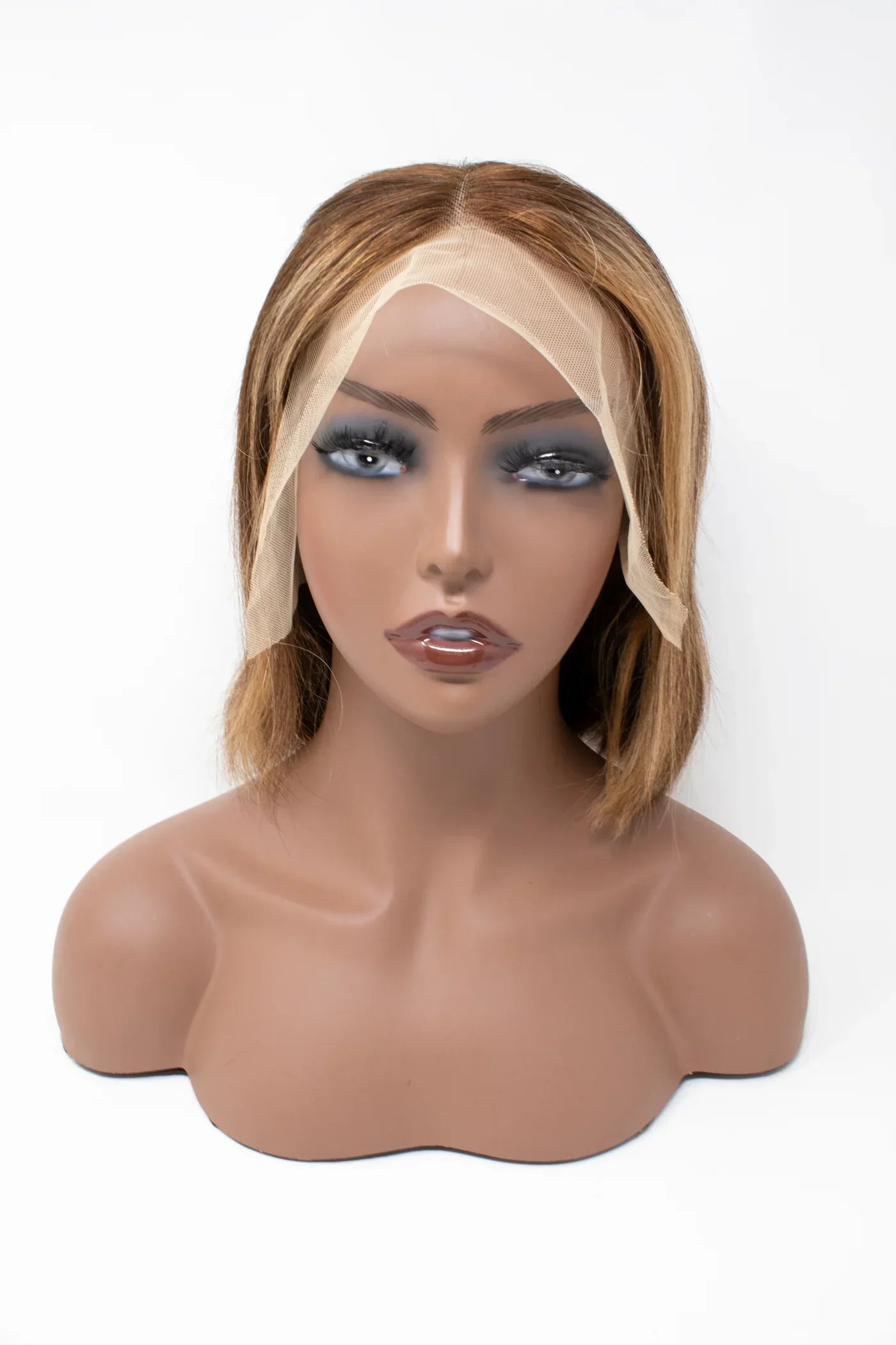 Human hair lace front wig with natural bob style on mannequin, showcasing seamless hairline and soft texture