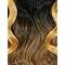 Ombre human hair wig with voluminous curls, dark roots fading to golden blonde tips