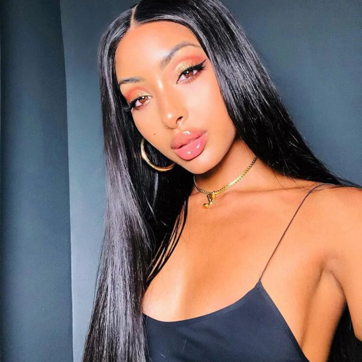 Long straight human hair wig with natural shine, perfect for sleek styles and everyday wear