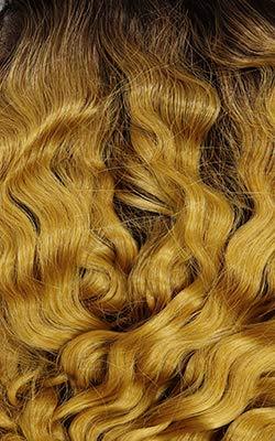 Luxury human hair wig with voluminous golden waves, perfect for natural styling and bold looks.