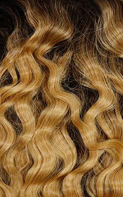Luxury human hair wig with voluminous honey blonde waves, perfect for natural styling