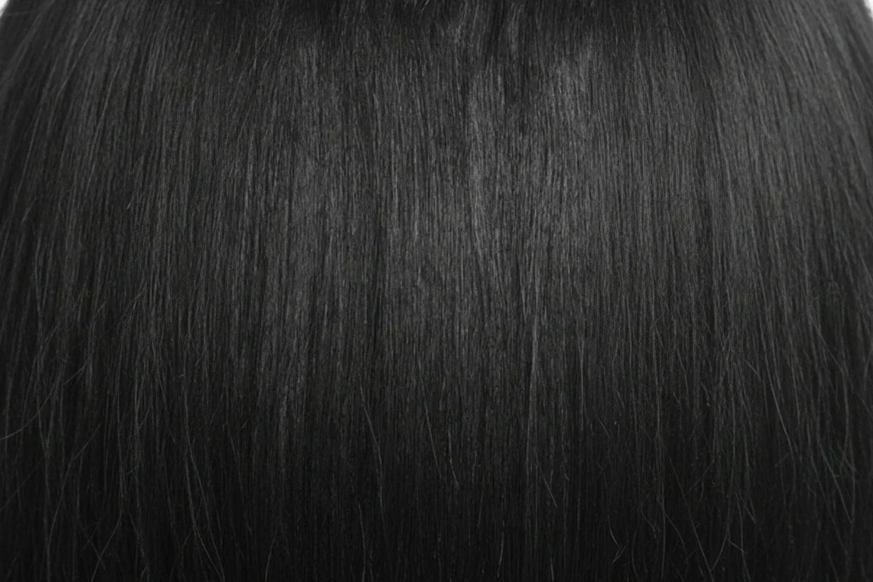 Two packages of Outre Premium Purple Pack Yaki hair extensions, showcasing the product as 100% human hair with a straight texture.