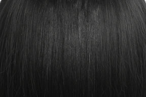 Two packages of Outre Premium Purple Pack Yaki hair extensions, showcasing the product as 100% human hair with a straight texture.