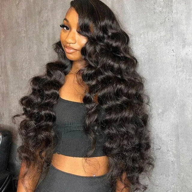 Long, voluminous human hair wig with deep waves, styled for natural, glamorous look