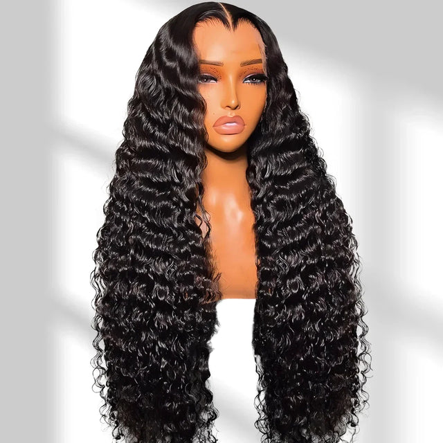 Mannequin head with long, black, wavy wig on a white background