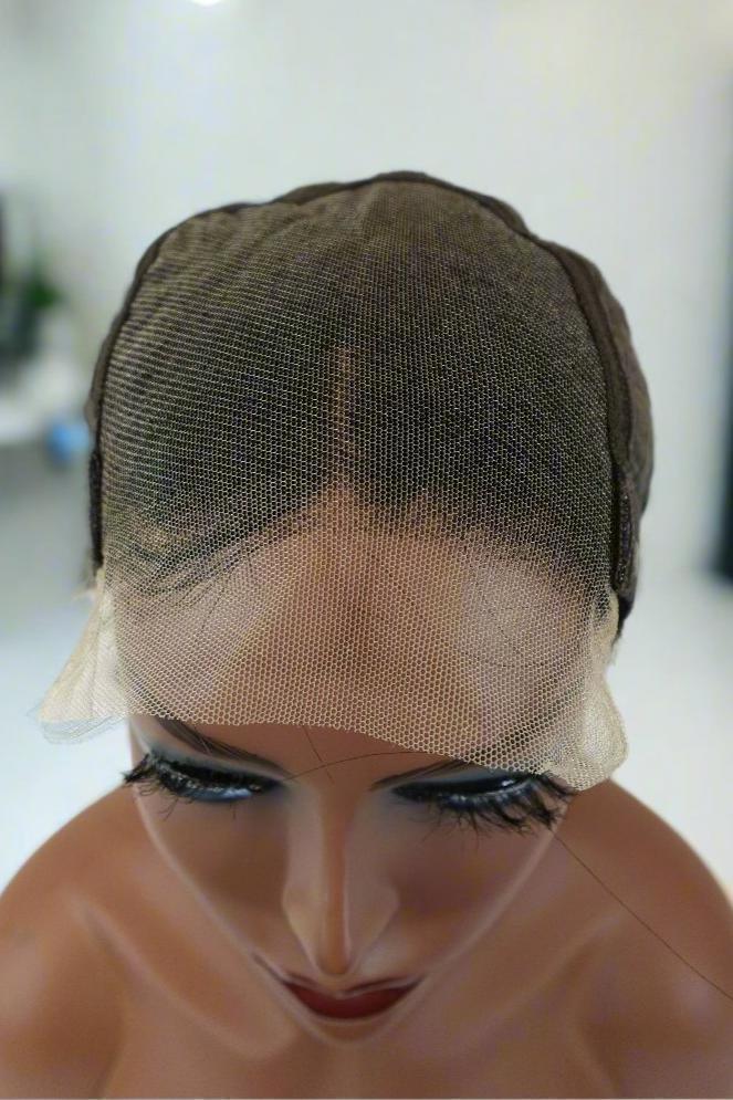 Lace front wig cap on mannequin head, showcasing natural hairline and breathable mesh for human hair wigs