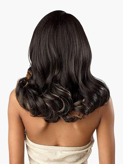 Back view of woman with long, wavy human hair wig featuring dark base and subtle highlights