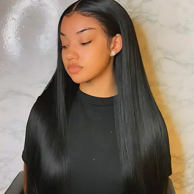 Long sleek black human hair wig with natural part, smooth texture, and glossy finish for everyday styling.