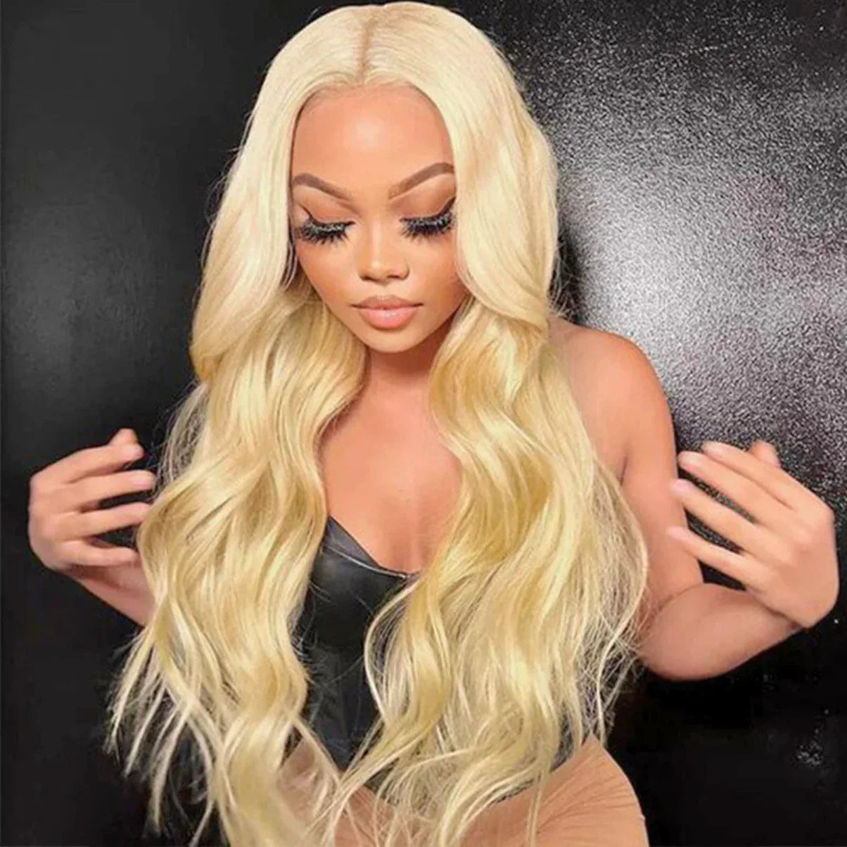 Blonde human hair wig with long body waves, natural-looking lace front for seamless styling